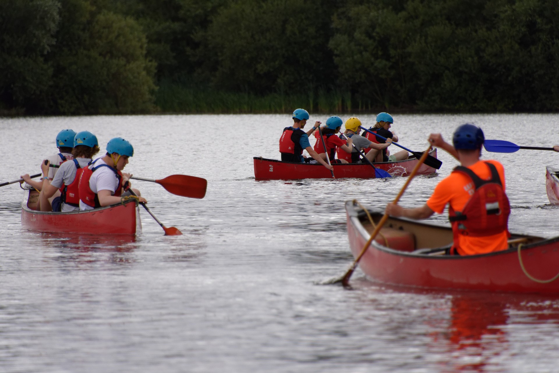 Campers canoeing down the river.